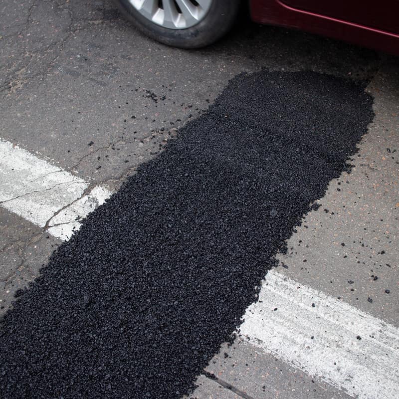 EZ Street repair along the edge of a crosswalk