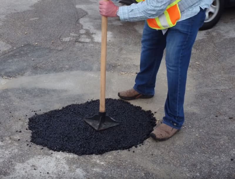 Hand-tamping an EZ Street patch