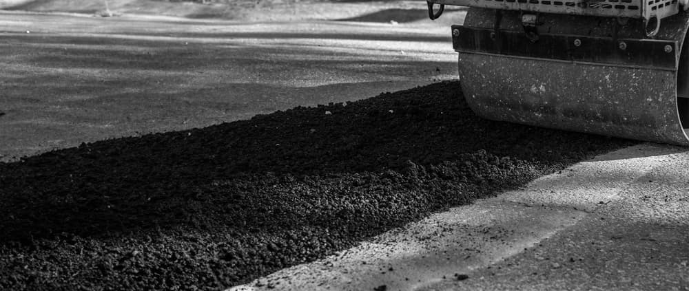 Roller compacting an EZ Street repair